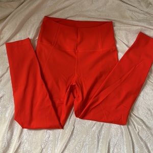 Girlfriend Collective high rise compression leggings in Daybreak orange